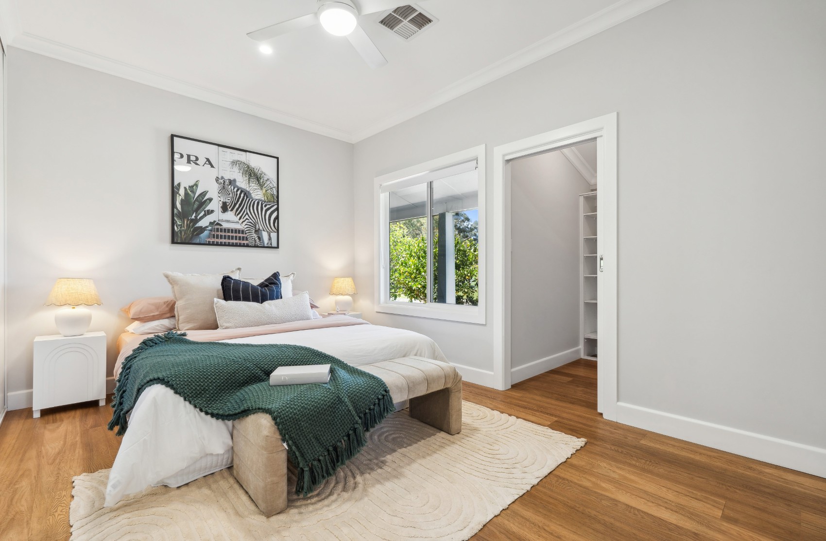 Bedroom and walk-in robe in the renovated Charleston home
