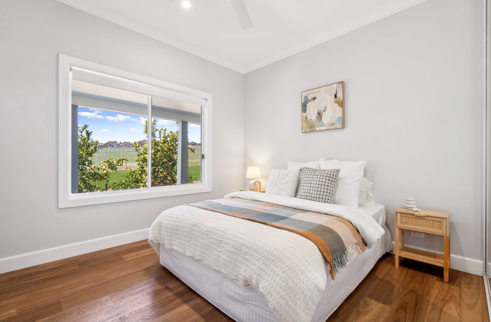 Bedroom with a garden outlook in the renovated Charleston home