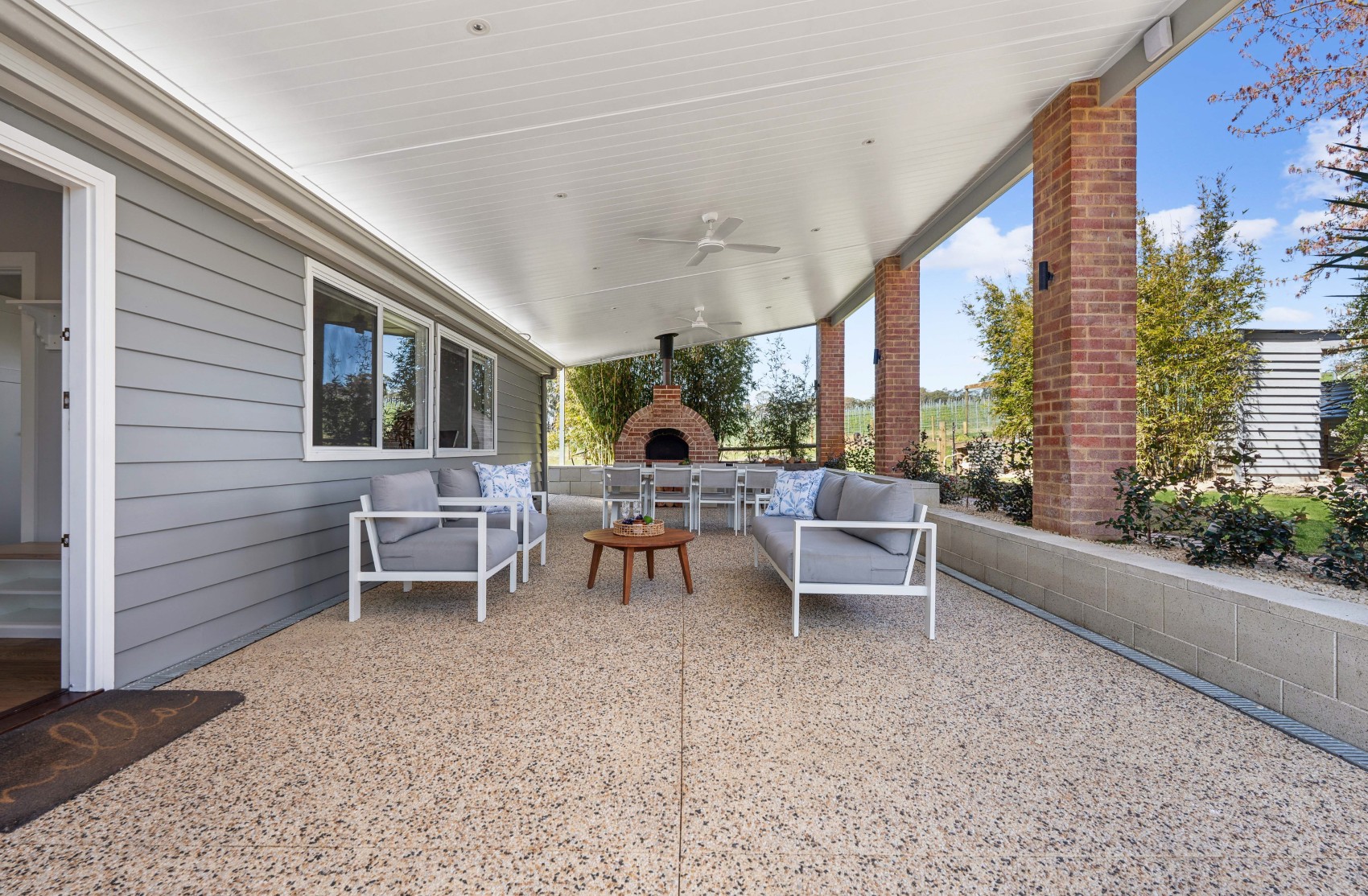 Lounge corner of the new Charleston alfresco, with the wood-fired pizza oven behind