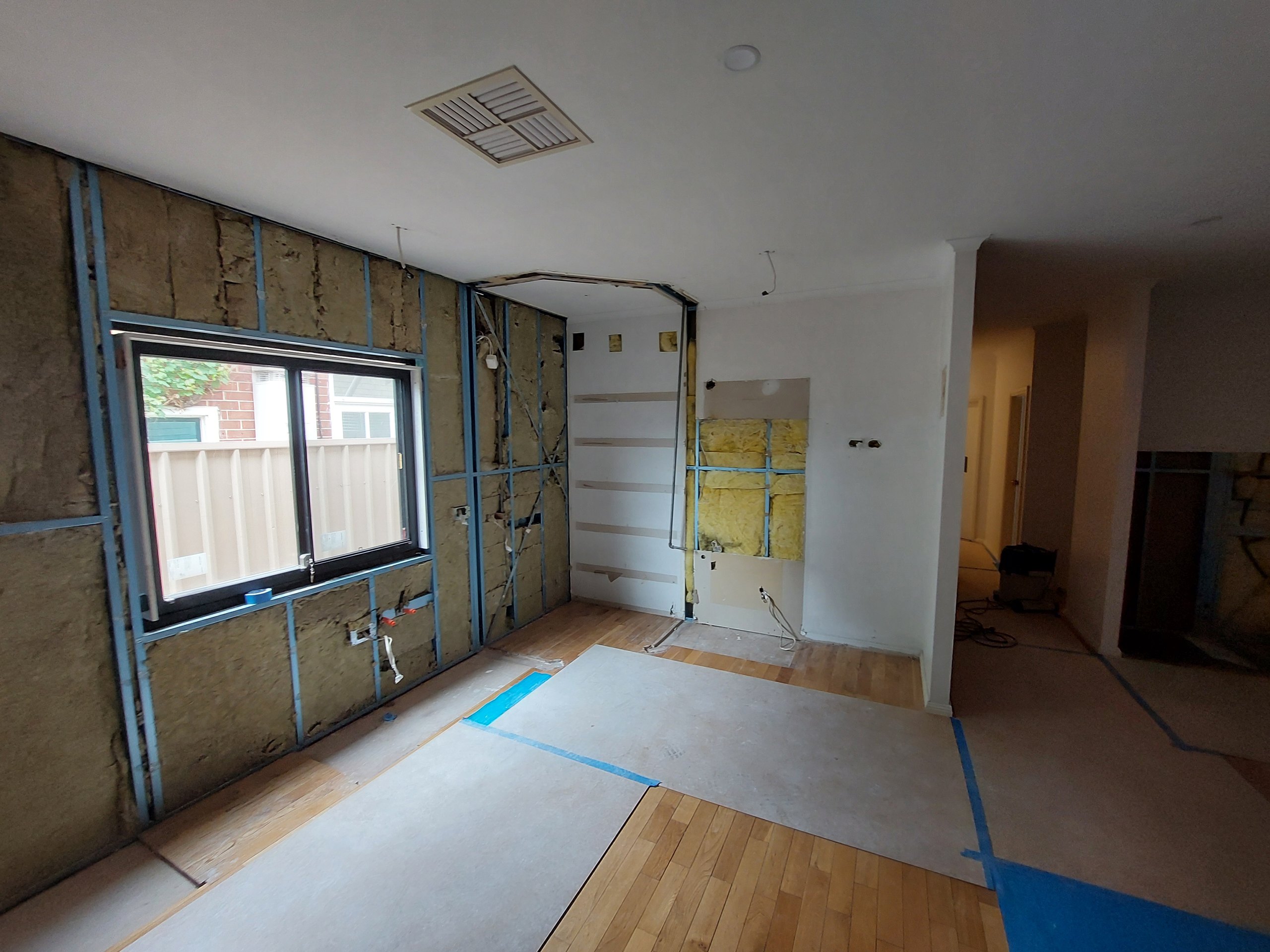 Stripped kitchen wall with the window opening framed up ready for the new double-glazed unit